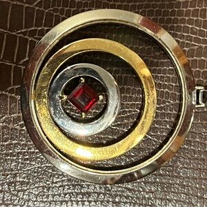 Elegant Gold and Silver Pendant with Red Accent